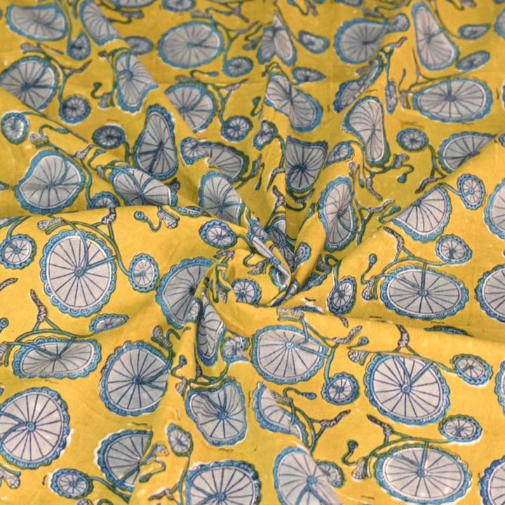 INDHA Hand Block-Printed Cotton Fabric | Grey Bicycle Design Motif Yellow Cotton Fabric | Hand Block Printed Fabric | Home Utility | Fashion Utility | Gifting | Gifts For Him | Gifts For Her | Home Furnishing | Jaipuri Block Print Fabric