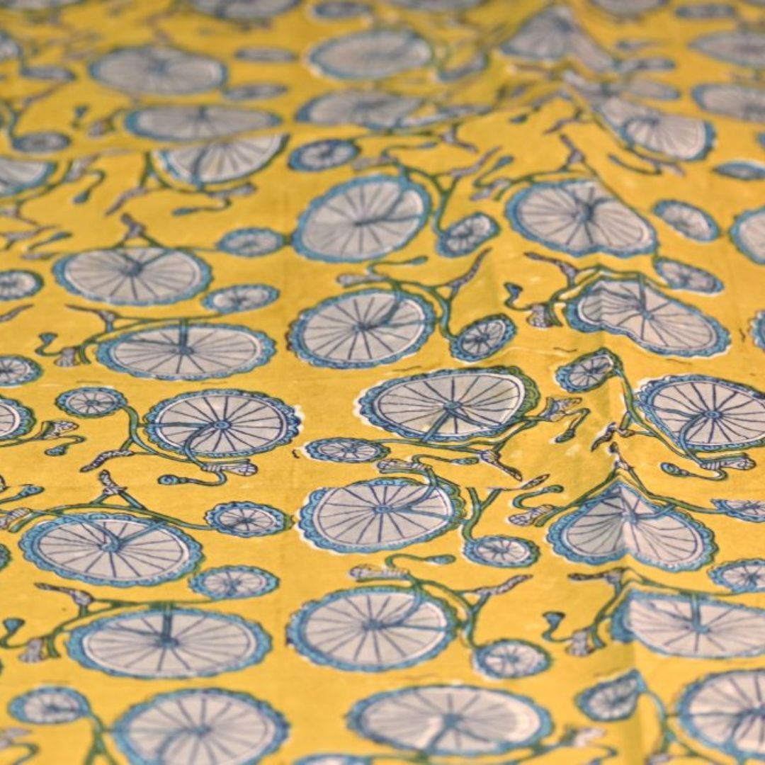 INDHA Hand Block-Printed Cotton Fabric | Grey Bicycle Design Motif Yellow Cotton Fabric | Hand Block Printed Fabric | Home Utility | Fashion Utility | Gifting | Gifts For Him | Gifts For Her | Home Furnishing | Jaipuri Block Print Fabric