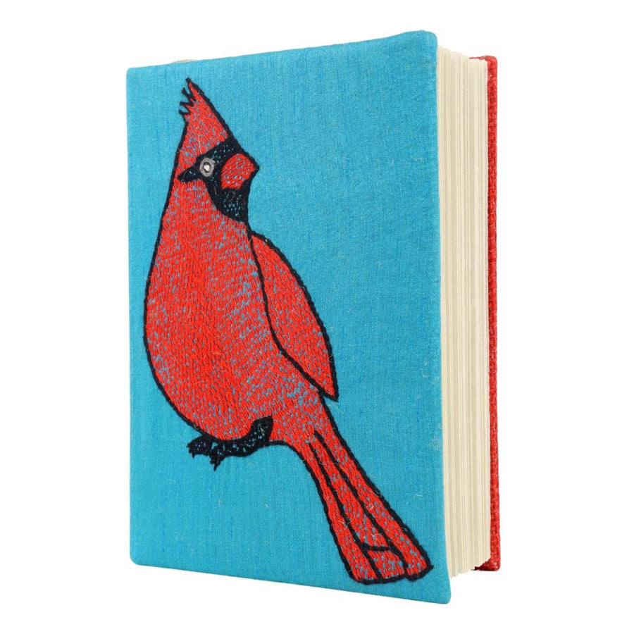 Diary with a red bird design on a blue dupion silk on white background (side view)