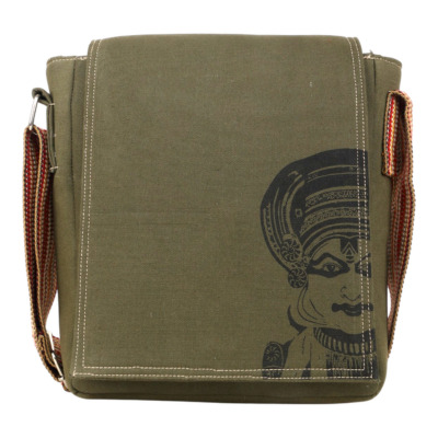 Green canvas bag with a kathakali design of a face on a white background (front view)