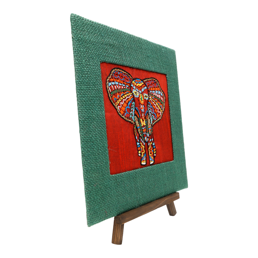 Indha Hand-Embroidered African Elephant – Silk Textile Art with Mini Wooden Easel A vibrant elephant motif stitched on rich silk—tabletop ready, gift-ready