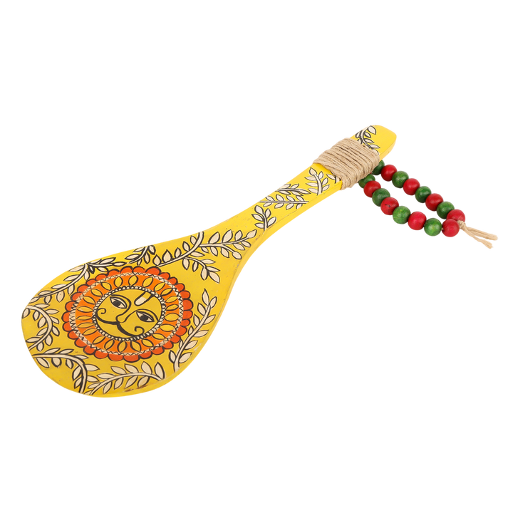 Click to see full view    Indha Hand-Painted Wooden Spoon Décor – Madhubani Sun Art | Yellow Wall Accent with Jute & Beads | Travel-Friendly Indian Souvenir | Handmade Gift