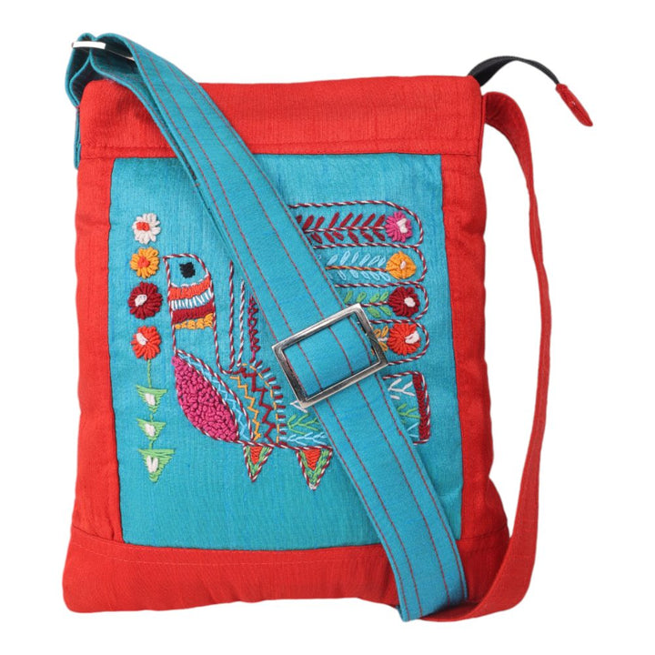 Indha Maroon Silk Sling Bag with Handcrafted Turkey Motif on Sky Blue Dupion – A Stylish and Elegant Accessory