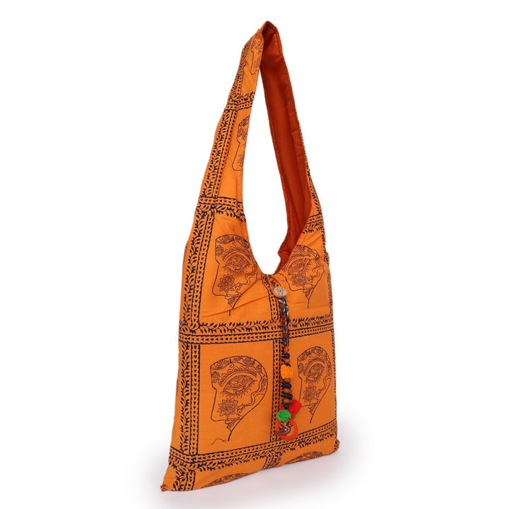 INDHA Woman Abstract Face Motif Hand Block-Printed Orange Cotton Jhola Bag With Multicolor Latkan | Multipurpose Cotton Bag | Hand Block Printed Bag | Eco-Friendly | Gifting |Shopping Bag | Tradiitional Cotton Bag