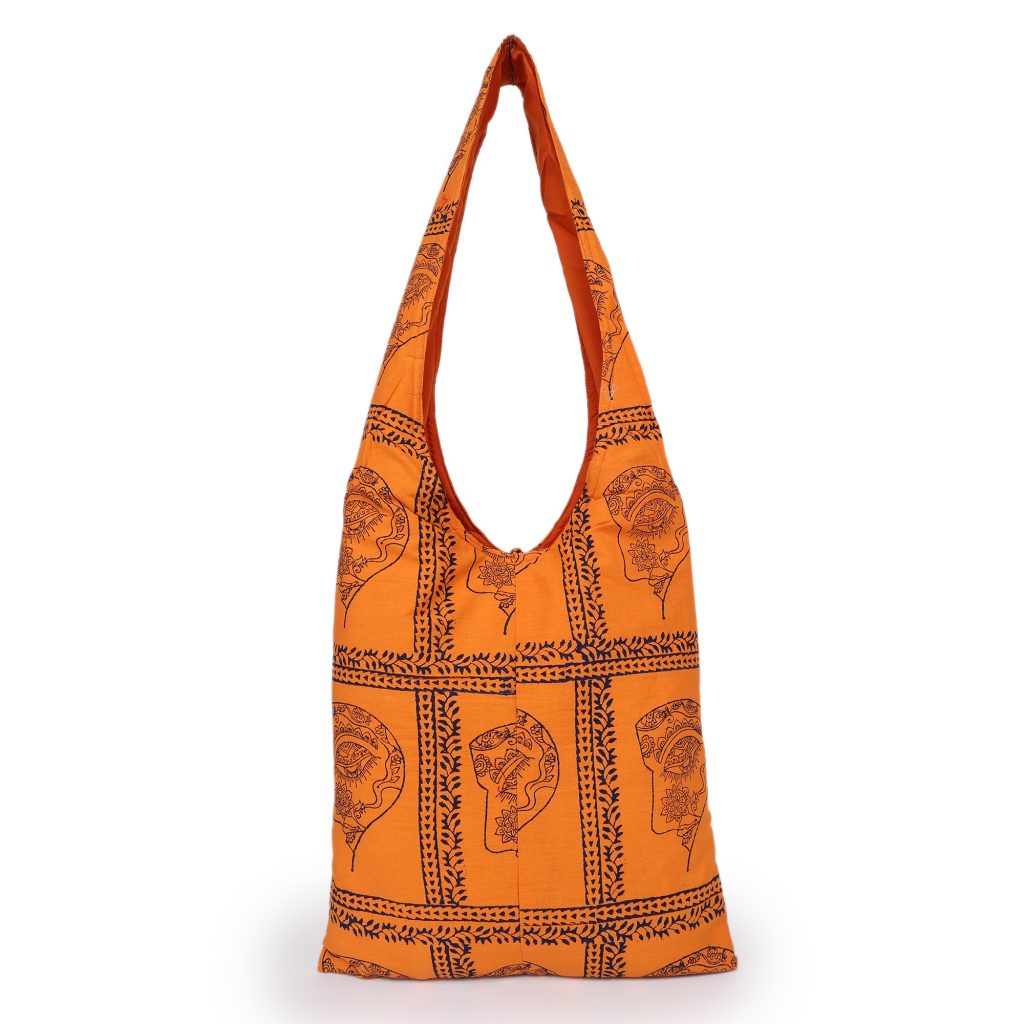 INDHA Woman Abstract Face Motif Hand Block-Printed Orange Cotton Jhola Bag With Multicolor Latkan | Multipurpose Cotton Bag | Hand Block Printed Bag | Eco-Friendly | Gifting |Shopping Bag | Tradiitional Cotton Bag