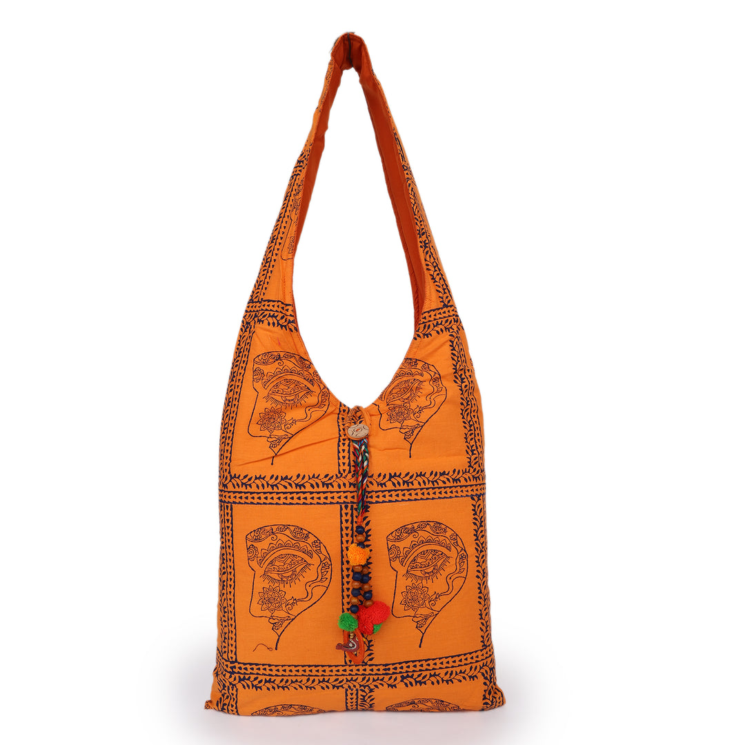 INDHA Woman Abstract Face Motif Hand Block-Printed Orange Cotton Jhola Bag With Multicolor Latkan | Multipurpose Cotton Bag | Hand Block Printed Bag | Eco-Friendly | Gifting |Shopping Bag | Tradiitional Cotton Bag