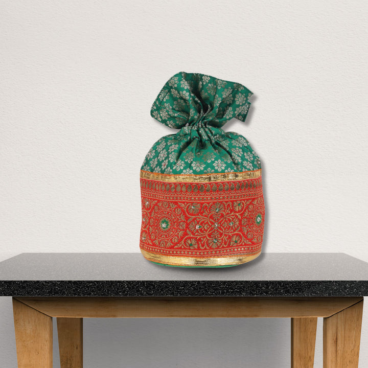 Indha Emerald Green Brocade Potli with Gota Lace Border – A Beautifully Crafted, Elegant Accessory for Celebrations, Weddings, and Traditional Festivities.