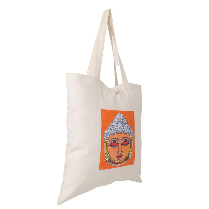 Indha Tote Bag with Lord Buddha Face Print |  Hand Block Printed Natural Cotton Shopping Bag | White and Orange Tote Bag | Eco-Friendly Handcrafted Tote | Single Compartment with Small Pocket | Button Closure | Vibrant and Spacious Bag |